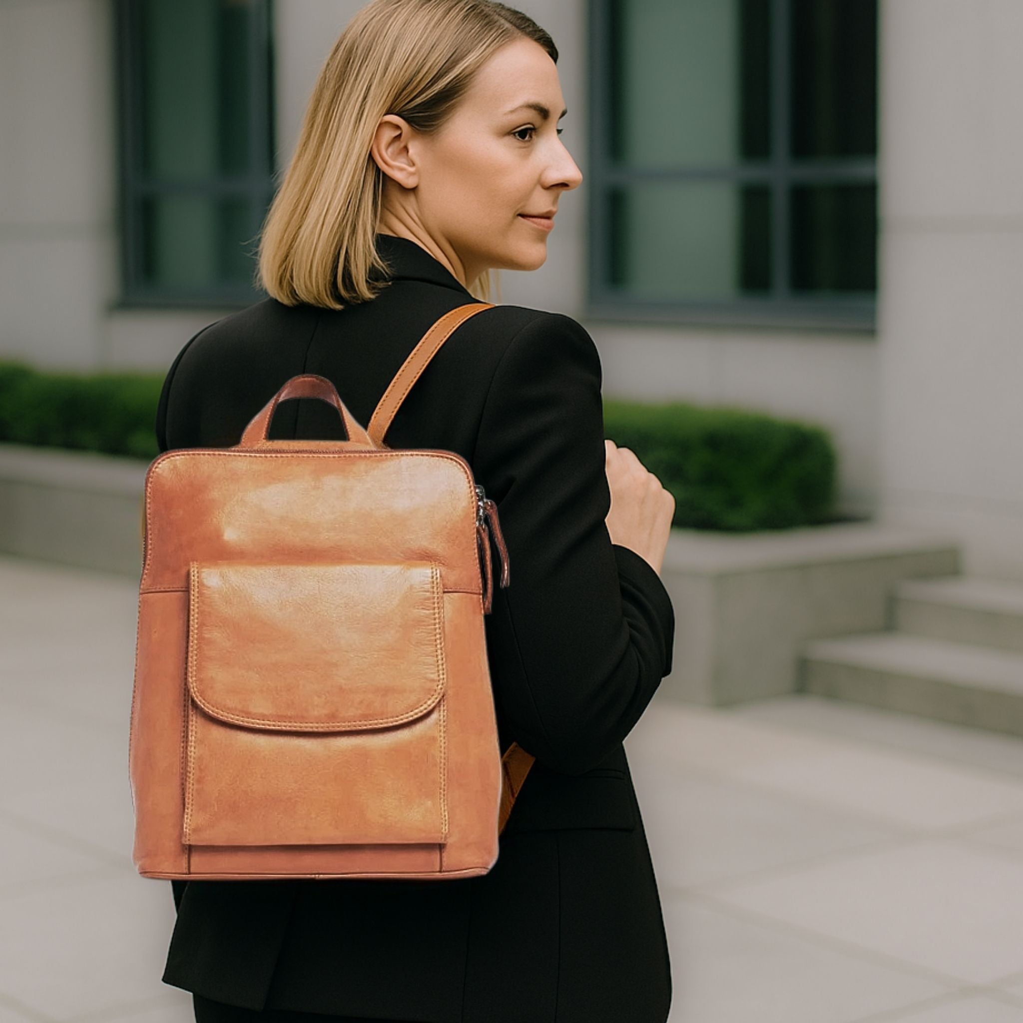 Lady-wearing-tan-leather-backpack-corporate-look-Vanessa_BeltUp Leather Co.
